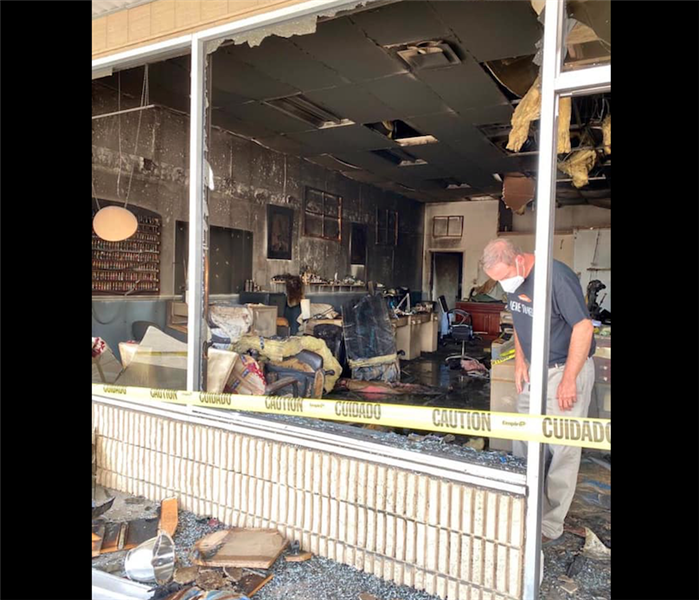 Severe Soot covering walls of commercial business with windows blown out