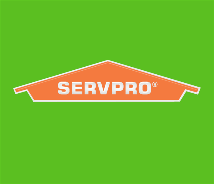 Orange SERVPRO logo with green background 